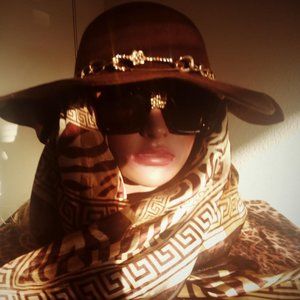 A -Symetrical Brown Hat with Gold Chain and Animal Print Scarf